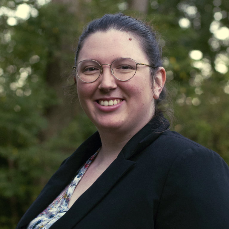 Image of Rebekah in front of trees.