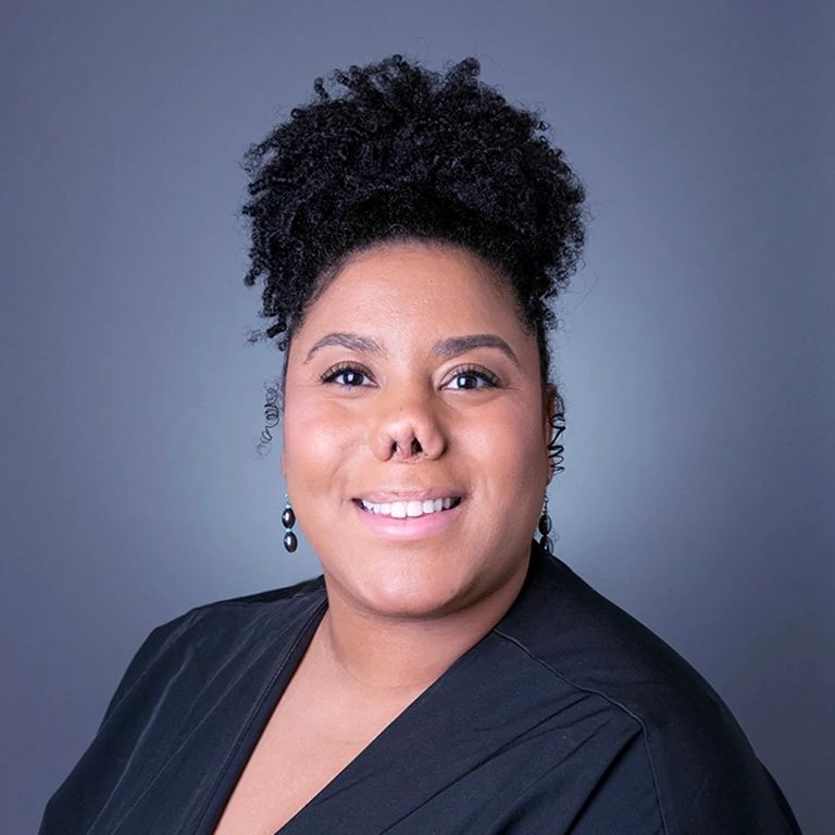 Image of Lauren Mixon in front of a grey background.